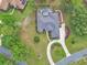 An aerial view showcasing a beautiful home with a private pool surrounded by lush landscapes at 1661 Timber Hills Dr, Deland, FL 32724