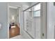 Bright bathroom featuring a shower with glass door and a view into an adjacent bedroom at 1661 Timber Hills Dr, Deland, FL 32724