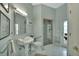 Spacious bathroom with walk-in shower, pedestal sink, and access to the backyard at 1661 Timber Hills Dr, Deland, FL 32724