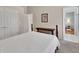 Comfortable bedroom featuring neutral decor, a queen bed, and an en-suite bathroom at 1661 Timber Hills Dr, Deland, FL 32724