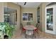 Covered patio with brick flooring, dining table, and view to the pool at 1661 Timber Hills Dr, Deland, FL 32724