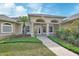 Inviting front entrance featuring well-manicured landscaping at 1661 Timber Hills Dr, Deland, FL 32724
