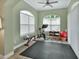 An en suite exercise room featuring new workout equipment and a large window at 1661 Timber Hills Dr, Deland, FL 32724