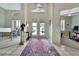 Beautiful foyer with tiled floor and front door looking out onto the front lawn at 1661 Timber Hills Dr, Deland, FL 32724