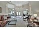 Open foyer with high ceilings leading to multiple rooms and beautiful glass paned front door at 1661 Timber Hills Dr, Deland, FL 32724