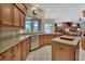 A spacious kitchen with custom cabinets, granite countertops, and stainless steel dishwasher at 1661 Timber Hills Dr, Deland, FL 32724