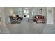 Another view of the sitting room showcasing comfortable furniture and french doors leading to the outdoor patio at 1661 Timber Hills Dr, Deland, FL 32724