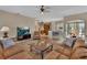 Open-concept living room seamlessly connecting to the kitchen and dining area, with ample natural light at 1661 Timber Hills Dr, Deland, FL 32724
