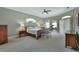 Spacious primary bedroom features an en suite exercise room, a ceiling fan, and large windows at 1661 Timber Hills Dr, Deland, FL 32724