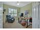 Cozy office space with comfortable furniture, natural light, and a ceiling fan at 1661 Timber Hills Dr, Deland, FL 32724
