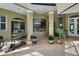 Covered patio with brick flooring, grill, and view of the pool at 1661 Timber Hills Dr, Deland, FL 32724
