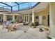 Brick paved patio area with seating, dining area, and shade at 1661 Timber Hills Dr, Deland, FL 32724