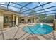 Screened in pool and patio area with outdoor furniture at 1661 Timber Hills Dr, Deland, FL 32724