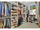 Organized walk-in closet featuring built-in shelving and ample hanging space for clothes and accessories at 1661 Timber Hills Dr, Deland, FL 32724