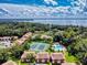 Panoramic aerial view of the community, lake, and surrounding landscape at 168 Perimeter Ct # 5B, Deltona, FL 32725