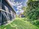 Spacious backyard with green lawn and screened-in patio at 168 Perimeter Ct # 5B, Deltona, FL 32725