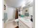 Well-lit bathroom featuring a shower-tub and a vanity with storage at 168 Perimeter Ct # 5B, Deltona, FL 32725