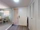 Inviting entryway featuring neutral tones, closet doors and adjacent dining room with comfortable seating at 168 Perimeter Ct # 5B, Deltona, FL 32725