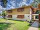 Beautiful condo exterior with well-maintained lawn and mature landscaping at 168 Perimeter Ct # 5B, Deltona, FL 32725