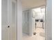 Bright hallway leading to an updated kitchen with stainless steel appliances and ample cabinet space at 168 Perimeter Ct # 5B, Deltona, FL 32725