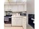 Efficient kitchen featuring white cabinets, modern appliances, and sleek countertops at 168 Perimeter Ct # 5B, Deltona, FL 32725
