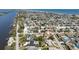 Neighborhood aerial featuring homes with pools between waterway and ocean at 18 Buckingham Dr, Ormond Beach, FL 32176