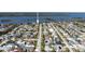 Neighborhood aerial view with homes and pools between the Intracoastal Waterway and the ocean at 18 Buckingham Dr, Ormond Beach, FL 32176
