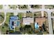 Aerial view of backyards with pools, privacy fences, and well-manicured lawns at 18 Buckingham Dr, Ormond Beach, FL 32176