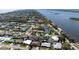 Coastal neighborhood aerial featuring a mix of homes, palm trees, and waterway views at 18 Buckingham Dr, Ormond Beach, FL 32176