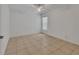 A bedroom with tile flooring and a ceiling fan provides a clean and simple aesthetic at 1925 Hamilton Ave, Orange City, FL 32763