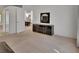 A bedroom with black wall unit, a decorative mirror, and an open doorway to a dining room at 1925 Hamilton Ave, Orange City, FL 32763