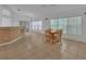 Bright dining area with tile flooring, breakfast bar, and natural light from large windows at 1925 Hamilton Ave, Orange City, FL 32763