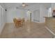 Open concept dining area with tile floors, connecting seamlessly to the kitchen and living spaces at 1925 Hamilton Ave, Orange City, FL 32763