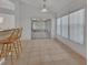 Bright dining area with bar seating and large sliding glass doors leading to the outdoor space at 1925 Hamilton Ave, Orange City, FL 32763