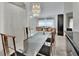 Open floor plan featuring a large dining room chandelier, with modern furnishings and bright light at 1925 Hamilton Ave, Orange City, FL 32763