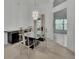 Dining room featuring modern light fixture, sleek table with seating and ample natural light at 1925 Hamilton Ave, Orange City, FL 32763