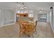 Open-concept kitchen and dining area featuring tile flooring and an open floor plan layout at 1925 Hamilton Ave, Orange City, FL 32763