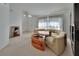 Bright living room showcasing a sectional sofa, custom coffee table, and unique decor at 1925 Hamilton Ave, Orange City, FL 32763