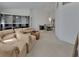 Open-concept living room with a sectional sofa, custom cabinetry, and access to the dining area at 1925 Hamilton Ave, Orange City, FL 32763
