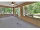 Covered patio with brick walls, concrete floor, and views of the yard at 1925 Hamilton Ave, Orange City, FL 32763