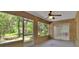 Enclosed patio with brick walls, multiple windows, and a ceiling fan at 1925 Hamilton Ave, Orange City, FL 32763