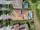 Aerial view of property showcasing the pool, pergola, and outlined yard, highlighting outdoor living spaces at 199 Verde Way, Debary, FL 32713