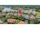 Neighborhood aerial view with lake, showing the property's location and nearby community amenities at 199 Verde Way, Debary, FL 32713