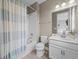 Well-lit bathroom with white tub, shower, vanity, and toilet at 199 Verde Way, Debary, FL 32713