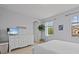 Bedroom with light gray walls, white furniture, natural light, and a charming 'Be Our Guest' sign at 199 Verde Way, Debary, FL 32713