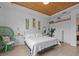 Inviting bedroom with wooden plank ceilings, coastal accents, and white walls at 199 Verde Way, Debary, FL 32713