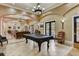The community clubhouse has a billiard room with a pool table, ample seating, and views of the pool at 199 Verde Way, Debary, FL 32713