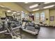 Community fitness center featuring treadmills, ellipticals, and other exercise equipment, all with large windows at 199 Verde Way, Debary, FL 32713