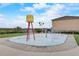 Community splash pad with water tower and colorful sprayers, perfect for hot days at 199 Verde Way, Debary, FL 32713
