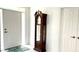 Inviting foyer with tile flooring, featuring a grandfather clock and a front door that lets in lots of natural light at 2053 Bond Rd, Deland, FL 32720